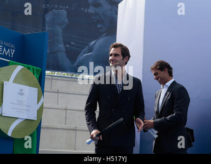 Mallorca, Spain. 19th Oct, 2016. Tennis player Rafa Nadal and Roger Federer gesture during the opening ceremony of the Rafa Nadal tennis academy in his birthplace village of Manacor, in the Spanish island of Mallorca. The academy pretends to become an international young talents training centre and have been promoted by Nadal who received the support of swiss player Federer during the opening. Credit:  zixia/Alamy Live News Stock Photo