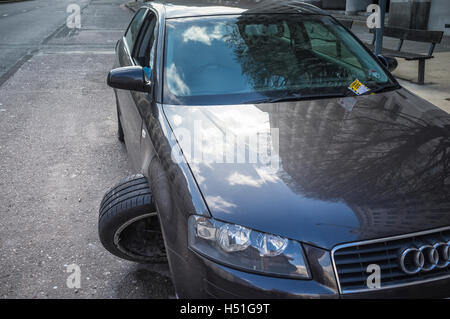 Parking ticket on broken-down car Stock Photo