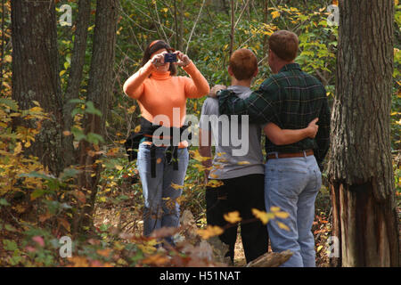 Family taking pictures on a hike Stock Photo