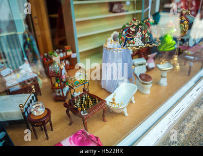 TRIER, GERMANY - APRIL 7, 2008: Exhibition of miniature toy furniture in the shop window Stock Photo