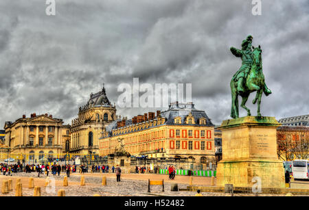 Statue of Louis XIV in front of the Palace of Versailles near Pa Stock Photo