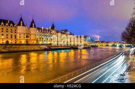 The Conciergerie and the Seine river in Paris - France Stock Photo