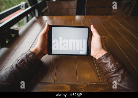 Close up image of man using a mobile digital tablet Stock Photo