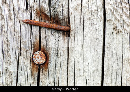 Background rusty nails in an old cracked wood Stock Photo