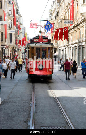 Street car and pedestrians on shopping street in Taksim district of Istanbul Stock Photo
