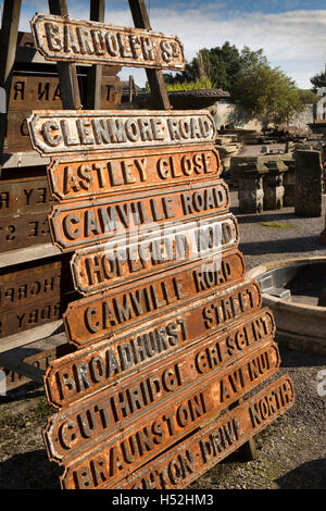 UK, England, Cheshire, Beeston Brook, Beeston Reclamation yard, old rusting cast iron road signs on diaplay Stock Photo