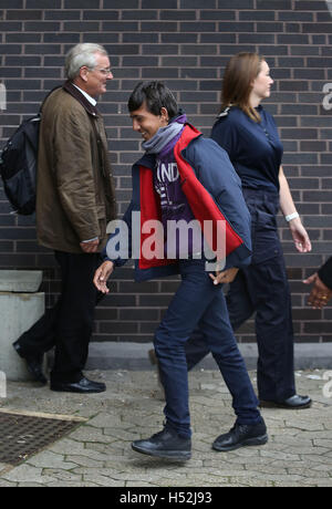 A teenager arrives at Lunar House in Croydon, south London from the 'Jungle' camp in Calais. Stock Photo