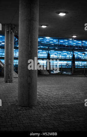 Concrete pillars in a covered parking area Stock Photo