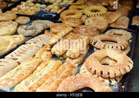 Trays of all kinds of Greek breads and pastries on display at a traditional bakery in Rethymno, Crete Stock Photo
