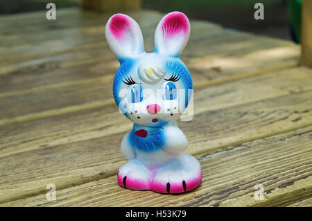 Old rubber toy in form of a colored rabbit for young children Stock Photo