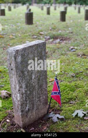 A grave marker with a confederate flag at the Confederate Cemetery in Fayetteville, Arkansas, USA. Stock Photo