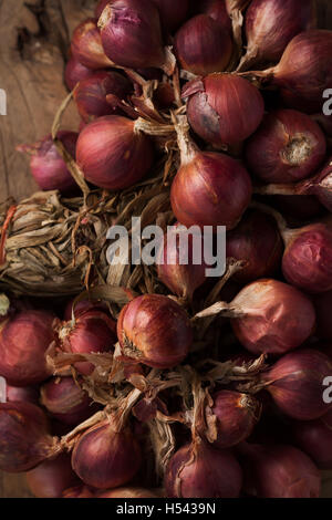 shallots still life wood background onion bulb season herb vegetable ingredient close up Stock Photo