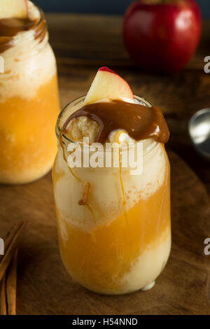 Cold Apple Cider Ice Cream Float with Caramel Sauce Stock Photo