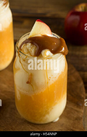 Cold Apple Cider Ice Cream Float with Caramel Sauce Stock Photo