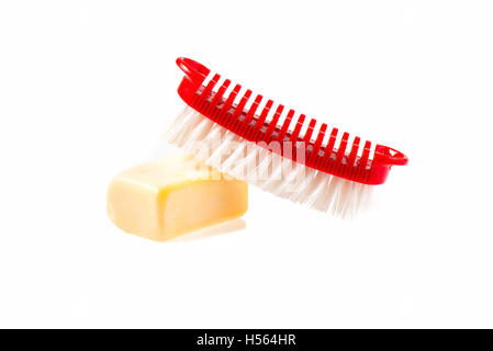 Red brush with soap on a white background Stock Photo
