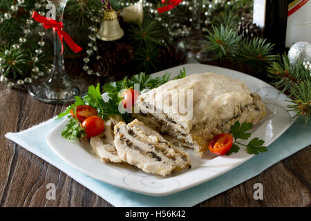 Homemade meatloaf with mushrooms and onions on a festive Christmas table. Stock Photo