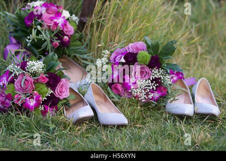 The wedding party kicks off their shoes to relax for a while before they return for the formal dinner and speeches. Stock Photo