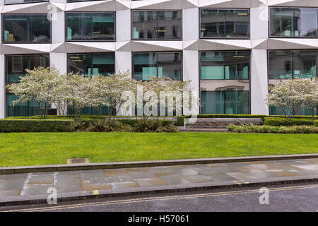 London, United Kingdom - April 2016: Cropped street view of a commecial office building. Frontal facade Stock Photo