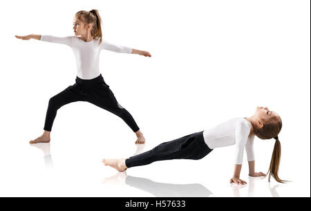 Little girl doing yoga exercises Stock Photo
