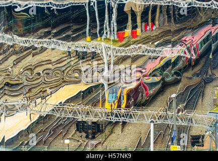Cross Country Trains Voyager train reflected in the mirror facade of Birmingham New Street Station Stock Photo
