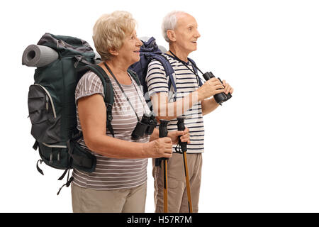 Mature hikers looking in the distance isolated on white background Stock Photo