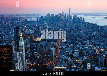 Sunset Manhattan down town aerial view from skycarpenter in warm light Stock Photo