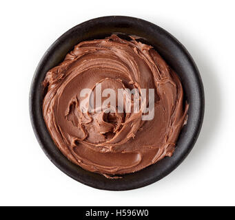 Chocolate cream in round dish isolated on white background, top view Stock Photo