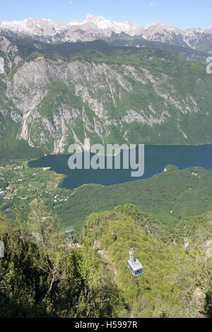 View down to Lake Bohinji from Mount Vogel in Triglav National Park, Northern Slovenia. Shows cable car in lower half of picture Stock Photo