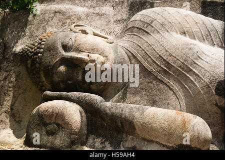 Reclining Buddha Statue at Thanthirimale Raja Maha Vihara ancient Buddhist temple, Anuradhapura district, Sri Lanka Stock Photo