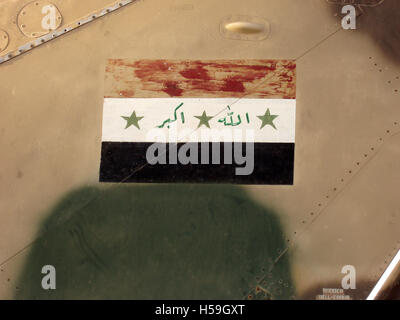 9th July 2003 Iraqi flag on the tail of a destroyed Soviet-made MiG-23 jet near the Balad Air Base, north of Baghdad, Iraq. Stock Photo