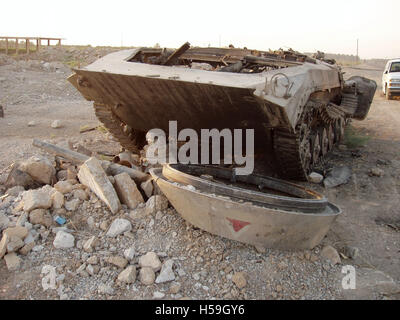 9th July 2003 A burned-out BMP-1 IFV lies abandoned by the roadside, about 25 miles (40Km) north of Baghdad on Highway One. Stock Photo