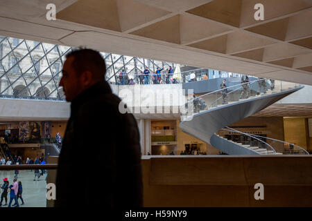 Heavily  armed soldiers patrol the popular musuem Louvre, Paris, as part of the state of emergency. Stock Photo