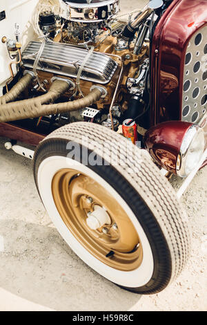 The front passenger side corner of a newly built rat rod sits quietly in the dust. Stock Photo