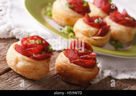 Beautiful bun with salami in the form of roses close-up on the table. horizontal Stock Photo