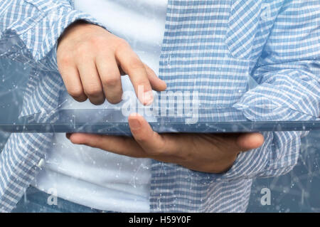 The cyber criminal person using a tablet in deep web cyberspace. Selective focus. Stock Photo