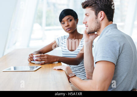 Young business people having a coffee break together in cafe Stock Photo