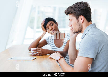 Young business people having a coffee break together in cafe Stock Photo