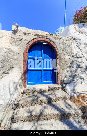 Blue wooden doors at the Church of Panagae, St Mary the Virgin, Agrilia, a village in the island of Thirassia, Santorini Stock Photo