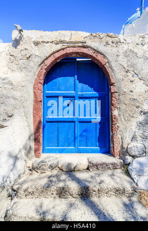 Blue wooden door at the Church of Panagae, St Mary the Virgin, Agrilia, a village in the island of Thirassia, Santorini Stock Photo