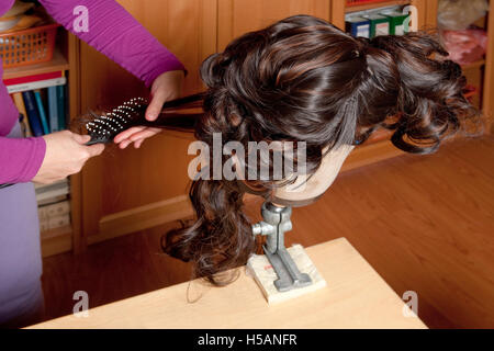 Professional Wig Maker Working in her Workshop. Stock Photo