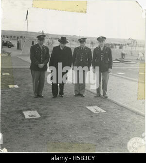 Chaplain Aryeh Lev and Doctor Barnett Brickner with others at the U. S. Cemetery in Cairo, Egypt Stock Photo