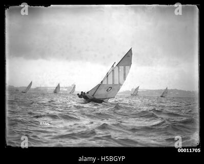 Sloops on Sydney Harbour, with Sydney Harbour Bridge construction in background Stock Photo