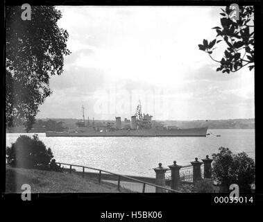 USS ASTORIA at anchor in Farm Cove, Sydney Stock Photo