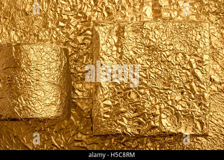 Gold foil figures Stock Photo