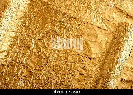 Gold foil figures Stock Photo