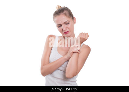 Wrist pain. Woman holding her wrist, isolated on white background Stock Photo