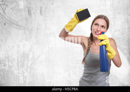 Young housewife woman cleaning, isolated on white background Stock Photo