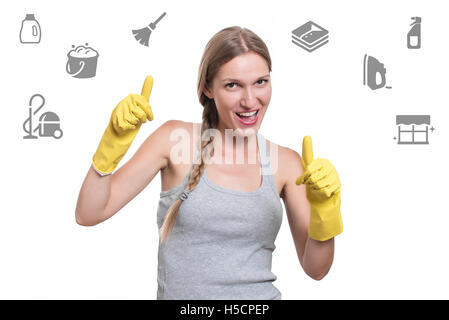 Woman ready for cleaning with rubber gloves and smiling Stock Photo