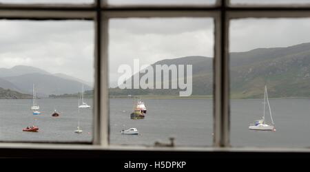 Looking at Loch Broom though a sliding sash window in Ullapool, Highland, Scotland, UK Stock Photo