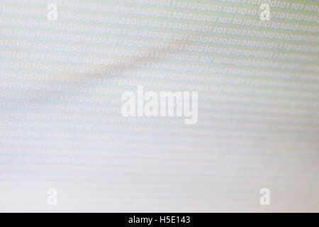 White numbers zero and one as a texture on a white, gray gradient background, laptop computer monitor Stock Photo